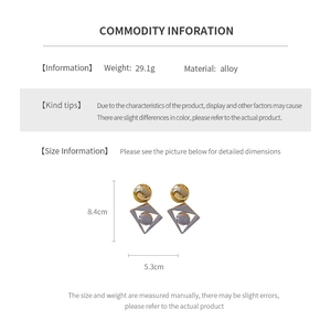 Detailed view of large geometric alloy drop earrings with precise dimensions and weight
