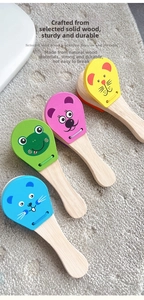 Close-up of four colorful animal-shaped wooden castanets for early childhood music education