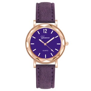 Detail view of purple quartz watch with rose gold case and faceted glass bezel