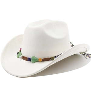 Detail of white suede cowboy hat featuring ethnic beaded band with heart-shaped turquoise