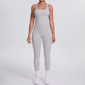 Detailed close-up of light gray ribbed racerback sports top and high-waisted yoga leggings