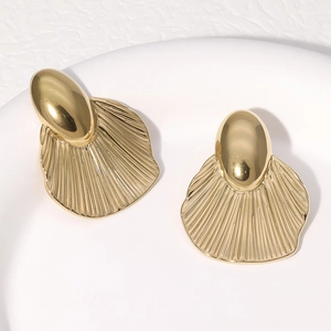 Minimalist gold titanium steel fan-shaped stud earrings with shell pattern on white plate