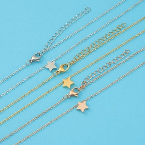 Detail of adjustable star pendant necklaces in silver, gold, and rose gold finishes