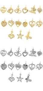 Macro detail of 18K gold and silver heart pendants with cubic zirconia and Mama engravings