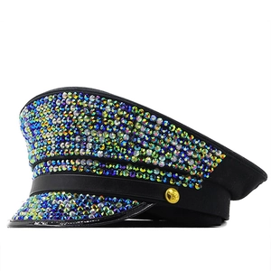 Flat top navy hat featuring colorful rhinestones and gold star decorative button
