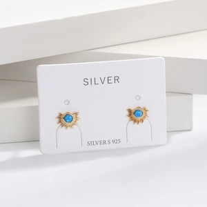 Macro shot of S925 sterling silver fan-shaped earrings with blue opal on white background