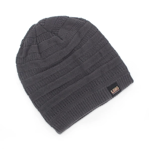 Detail showing the thick rib-knit texture and LEOS CHANCE logo tag on a grey beanie