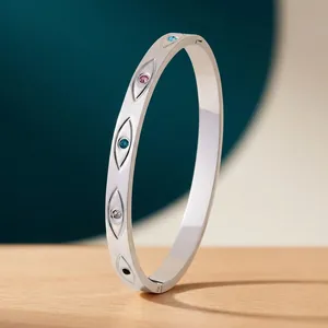 Waterproof silver evil eye cuff bracelet with multi-colored crystals and 18K gold plating