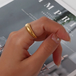 Elegant 18K gold-plated stainless steel ribbed croissant ring on a model hand