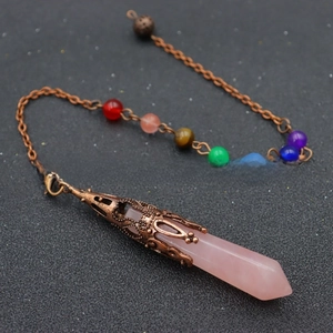 Detail of pink crystal hexagonal pendant with chakra beads on vintage bronze chain