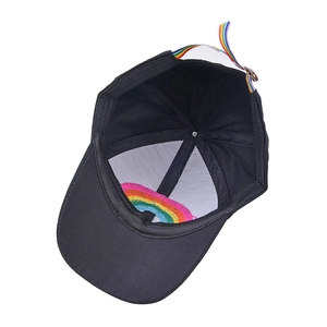 Kids black cotton baseball cap with rainbow strap and embroidery detail, overhead view