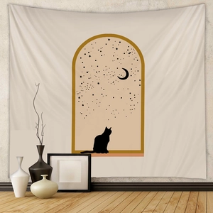 Detail of bohemian wall tapestry featuring minimalist cat and moon arched window art