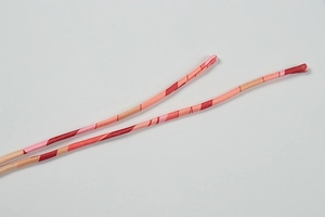 Macro shot of colorful spiral print spaghetti straps with high elasticity fabric texture