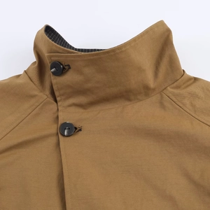 Classic camel double-sided trench coat featuring a stylish lapel and premium button details