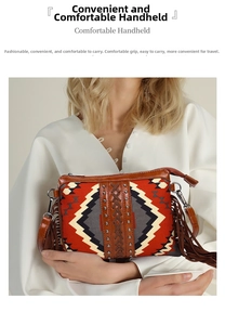 Detail of bohemian woven clutch with geometric patterns, leather studs, and long side fringes