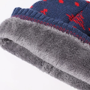 Thick navy blue knitted hat with warm gray faux fur lining and red winter patterns