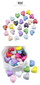 Macro shot of colorful iridescent acrylic heart beads for DIY jewelry and phone chains