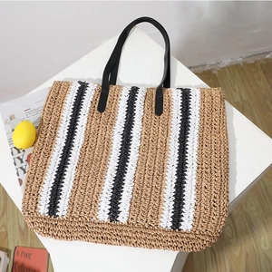 Striped straw tote bag with black leather handles for summer beach vacations and daily use