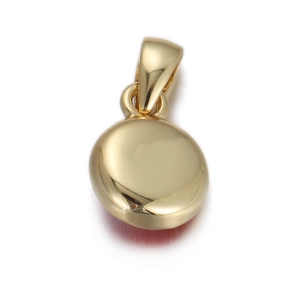Close-up of polished gold-plated copper lucky evil eye pendant with smooth metallic finish