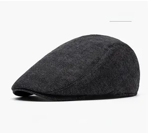Side view of black flat cap showing detailed textured fabric and vintage profile