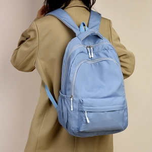 Light blue waterproof nylon backpack with multiple pockets for school and travel