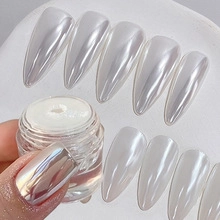 Macro detail of iridescent pearlescent nail powder and reflective aurora effect nails