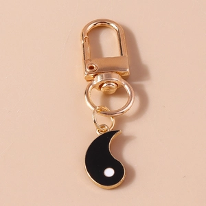 Retro Tai Chi Yin Yang pendant keychain in gold finish with creative vintage aesthetic