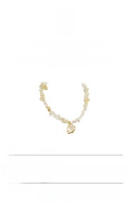 Detail view showing natural baroque pearl necklace with yellow citrine and 18K gold beads