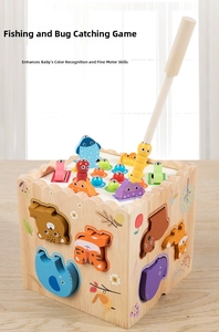 Detail showing magnetic fishing game and insect catching toy on a wooden busy box