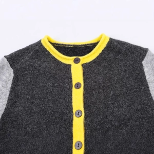 Women's color block knit cardigan with yellow trim and round neck button closure