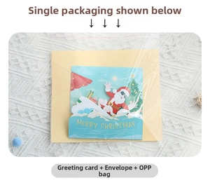 3D Christmas card set featuring surfing Santa with yellow envelope in clear packaging