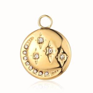 Close-up of golden celestial sun and moon pendant with sparkling inlaid rhinestones