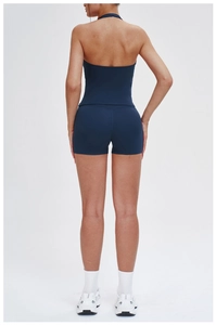 Rear view of deep blue backless yoga top and high-waist shorts set for women