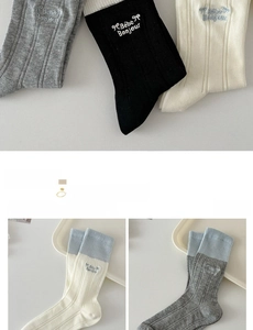 Detail of cotton socks showing Bebe Bonjour embroidery and bow patterns on the cuff