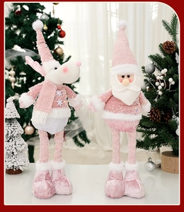 Detail of pink sequin reindeer and Santa Claus plush toys with telescopic legs decoration