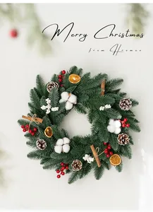 Detailed Christmas wreath with cotton, pine cones, berries, orange slices and cinnamon