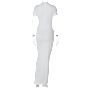 Detail view of the back of a white short-sleeve maxi dress with round neck and tight fit