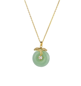 Detail of gold titanium necklace with green jade donut pendant and sparkling crystals