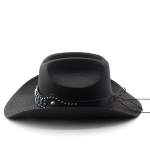 Detail of black western straw hat featuring studded leather band and turquoise accents
