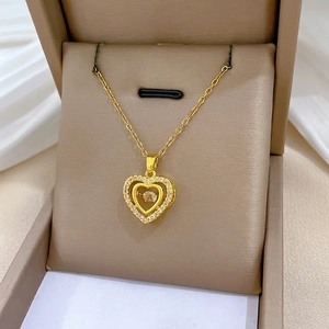 Luxurious gold double-layered heart necklace with sparkling crystals and a moving diamond