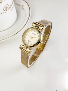Detail of BARSH gold vintage watch with crystal markers and stainless steel mesh strap