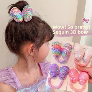 Detail of sequined butterfly hair ties for girls in multiple colors and elastic bands