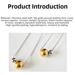 Macro detail of bicolored titanium steel bead pendant with 18k gold plating finish
