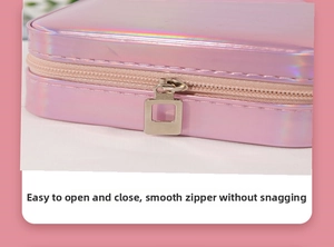 Close-up of smooth square hollow metal zipper on pink holographic jewelry storage case