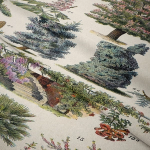 Close-up of vintage botanical tapestry fabric texture showing detailed weave and patterns