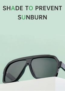 Close-up of black square frame sunglasses on a minimalist white stand with green background