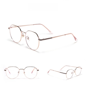 Detail view of rose gold round metal glasses with adjustable nose pads and thin frames