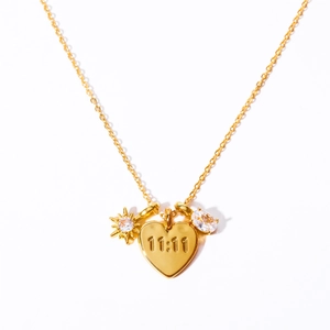Gold heart necklace with 11:11 engraving and sparkling zircon charms on a delicate chain