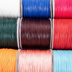 Macro display of nine colorful waxed polyester cords for DIY jewelry making and weaving
