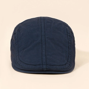 Detailed top view of navy blue flat cap featuring durable cotton stitching and retro design